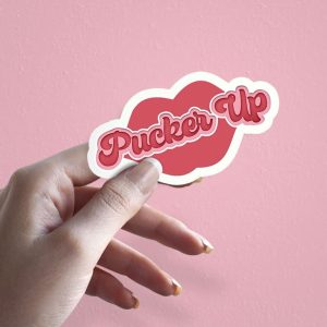 Woman holding Pucker Up couples love sticker